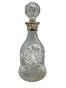 Glass decanter with wide foot featuring silver collar by Mappin and Webb