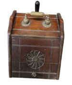 Oak coal scuttle with ornate handle and one shovel