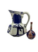 Davenport ironstone serpentine jug together with long necked Japanese imari vase max H18cm