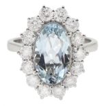 18ct white gold oval aquamarine and round brilliant cut diamond cluster ring