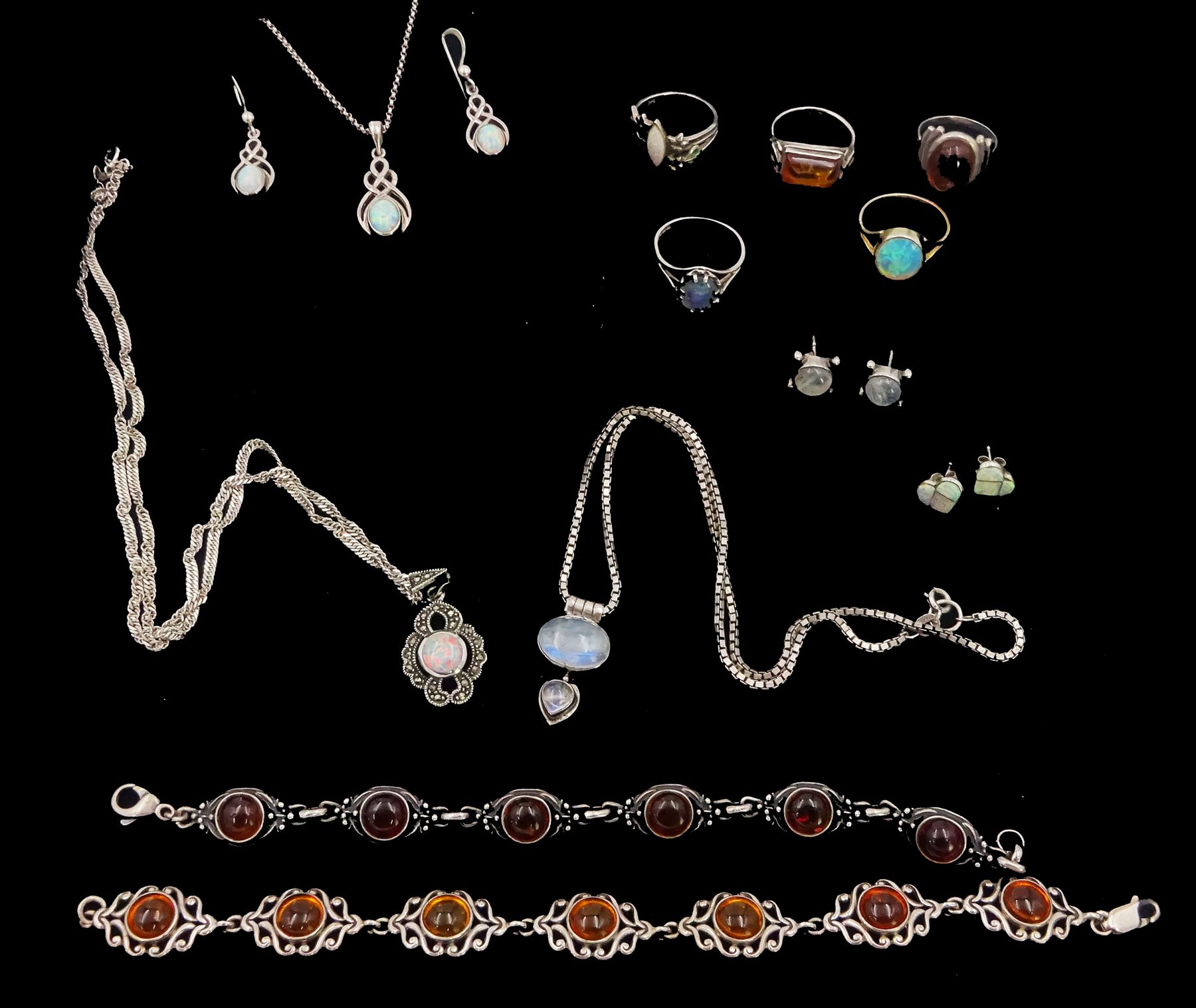 Silver stone set jewellery including