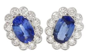 Pair of 18ct white gold milgrain set oval sapphire and round brilliant cut diamond stud earrings