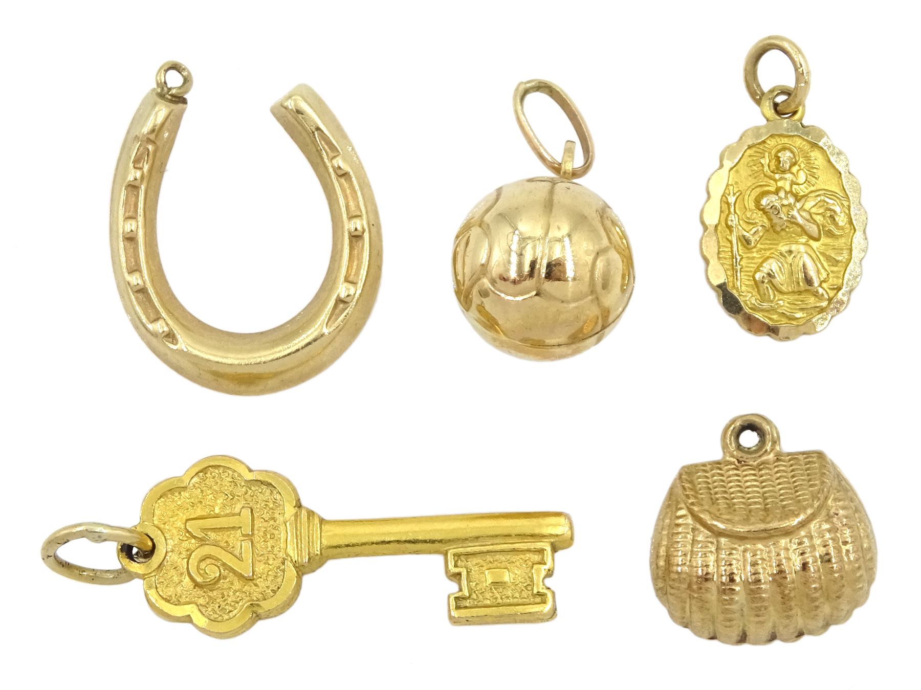 Two gold 21 key and St Christopher charms by Georg Jensen and three other gold charms including purs