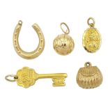 Two gold 21 key and St Christopher charms by Georg Jensen and three other gold charms including purs