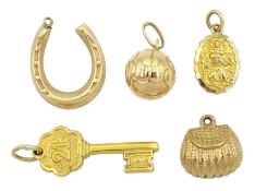 Two gold 21 key and St Christopher charms by Georg Jensen and three other gold charms including purs