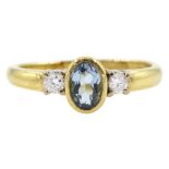 18ct gold three stone oval aquamarine and round brilliant cut diamond ring