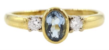 18ct gold three stone oval aquamarine and round brilliant cut diamond ring