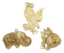 14ct gold eagle charm and two 9ct gold hippopotamus and fish charms