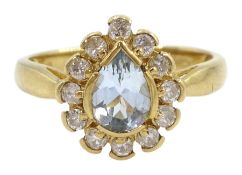 Gold pear shaped aquamarine and round brilliant cut diamond cluster ring