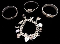 Silver jewellery including curb link bracelet with heart locket clasp and eleven charms including po