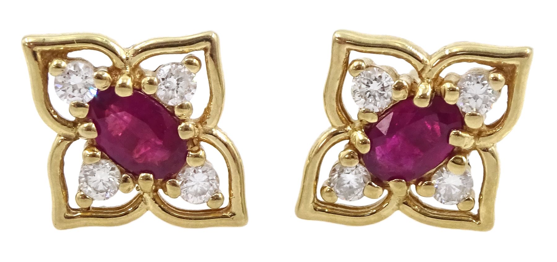 Pair of 9ct gold oval ruby and round brilliant cut diamond flower design stud earrings