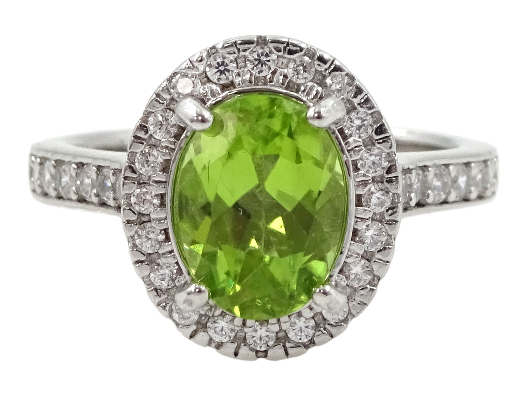 Silver oval peridot and cubic zirconia ring