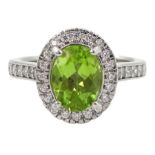 Silver oval peridot and cubic zirconia ring