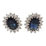 Pair of 9ct gold oval sapphire and diamond cluster stud earrings