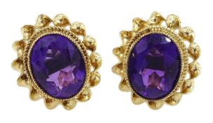 Pair of 9ct gold oval amethyst stud earrings