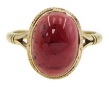 Gold single stone oval cabochon garnet ring