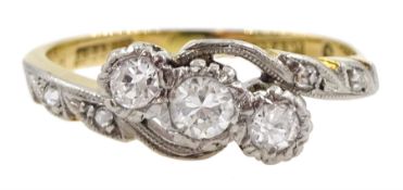 Gold three stone diamond crossover ring