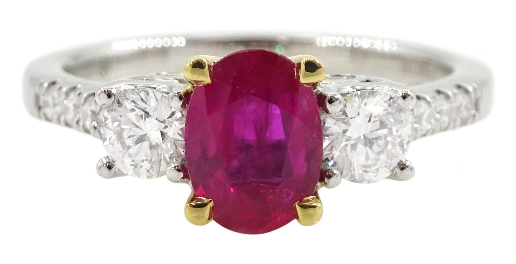 18ct white gold three stone oval ruby and round brilliant cut diamond ring