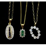 Three 9ct gold pendant necklaces including emerald and diamond