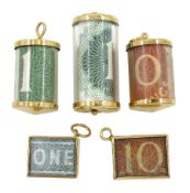 Five 9ct gold bank note charms