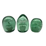 Victorian green glass dump paperweight with flower pot inclusion H11cm and two smaller