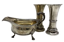 Silver sauce boat with C scroll handle Birmingham 1927 and a pair of silver waisted vases H14cm