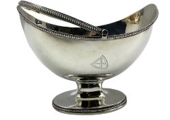 George III silver oval sugar basket engraved with a shield shape crest