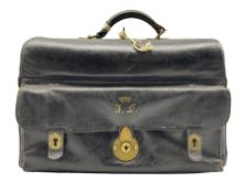 Black leather fitted Gladstone bag with lined interior containing various leather fittings
