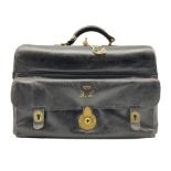 Black leather fitted Gladstone bag with lined interior containing various leather fittings