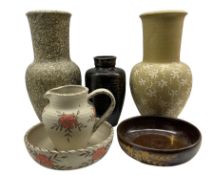 Group of Aislaby studio pottery items including large vase decorated with trailing leaves on a stone