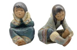 Two Lladro figures 'Eskimo Girl with Cold Feet' no. 2157 and 'Pensive Eskimo Girl' no. 2158 H16cm (2