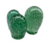 Victorian green glass dump paperweight with elongated bubble inclusions H15cm and two other very sim