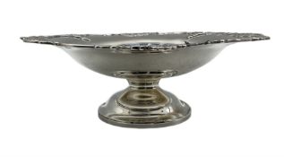 Silver cake dish with pierced moulded border