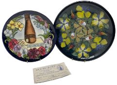 Two Moorcroft plates comprising a Limited Edition Centennial plate no. 573/750 with certificate and