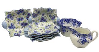 Shelley 'Dainty Blue' sugar bowl and jug together with 'Blue Pansy' pin dishes (8)