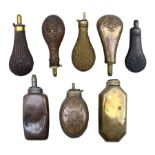 Eight copper and brass powder flasks including two by Sykes Patent