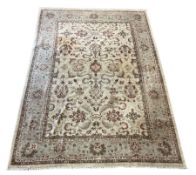 Pakistani Ziegler carpet with stylised floral motifs on beige field