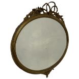 Gilt framed oval wall mirror with floral and foliate decoration