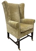 19th century wingback armchair upholstered in ivory fabric