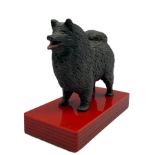Bronzed model of a Chow Chow on red acrylic base