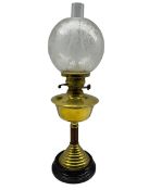 An Eltex brass column table oil lamp with etched glass shade