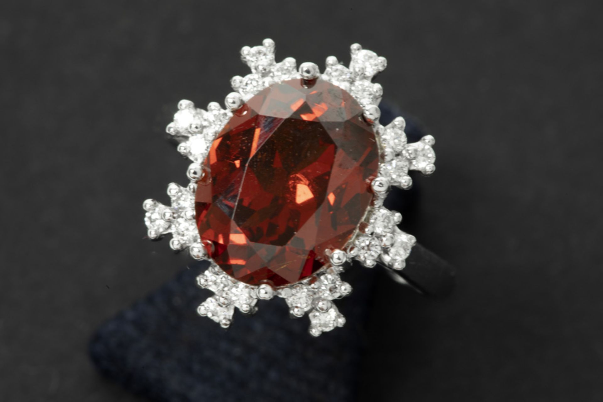 ring in white gold (18 carat) with a ca 6 carat garnet with nice and deep color and brilliance and