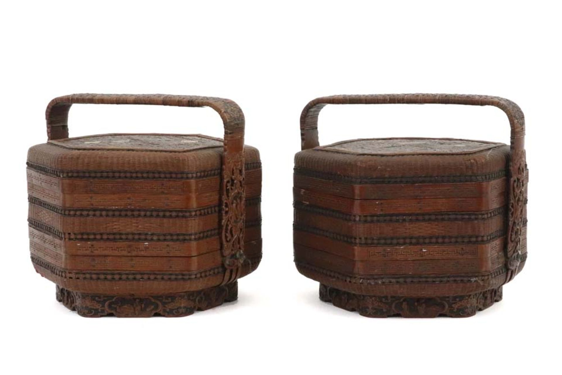 two Qing period Chinese baskets (each with two trays, a lid and a grip) in tressed fibres and