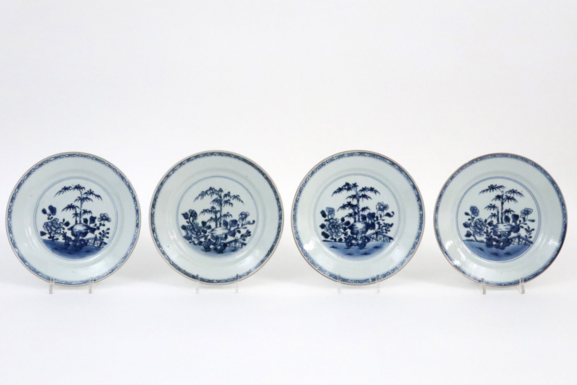 set of four 18th Cent. Chinese plates in porcelain with blue-white garden decor || Set van vier