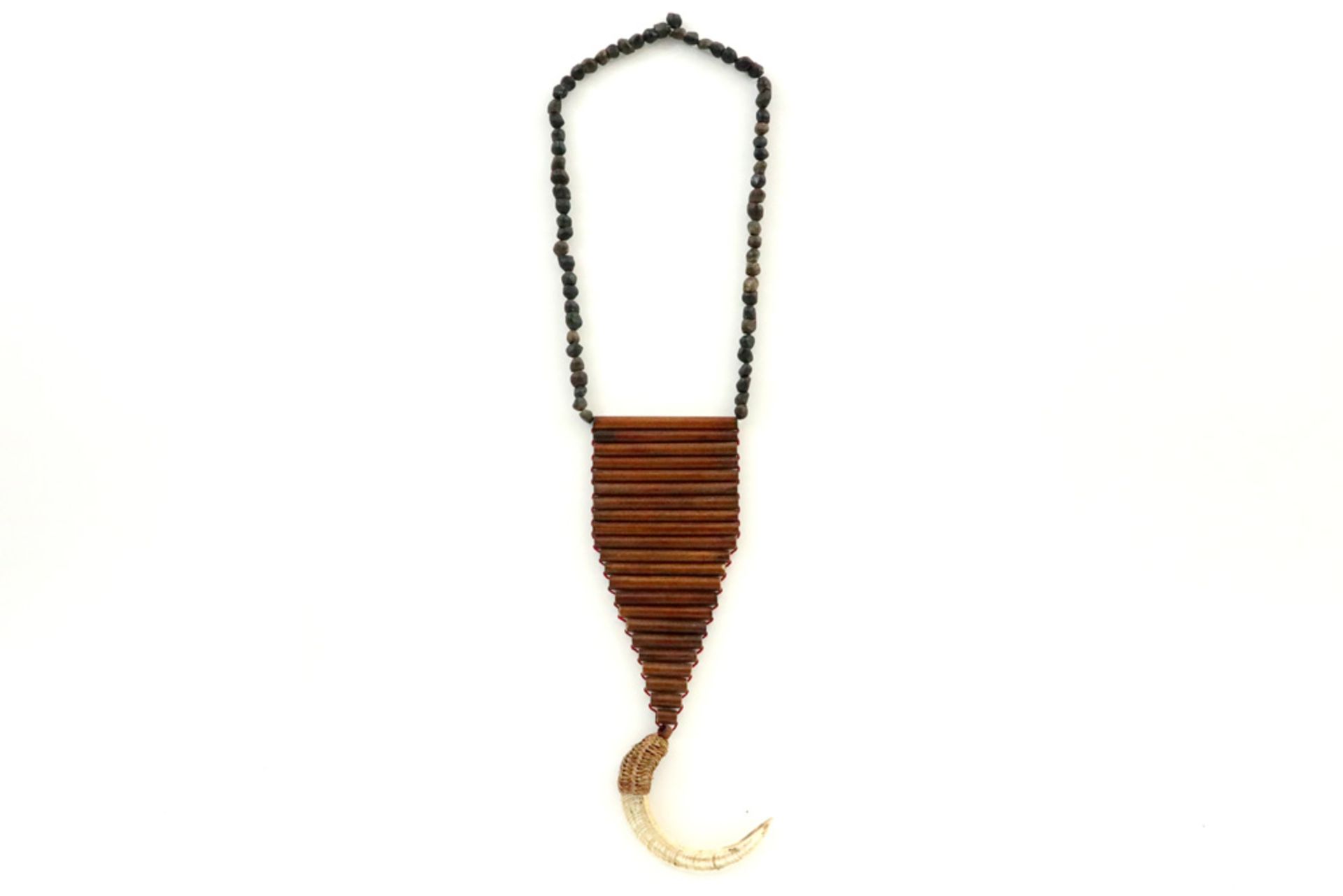 Papua New Guinean Western "Enga" Highlands "Kina" breastpiece of necklace with a shell on a fiber