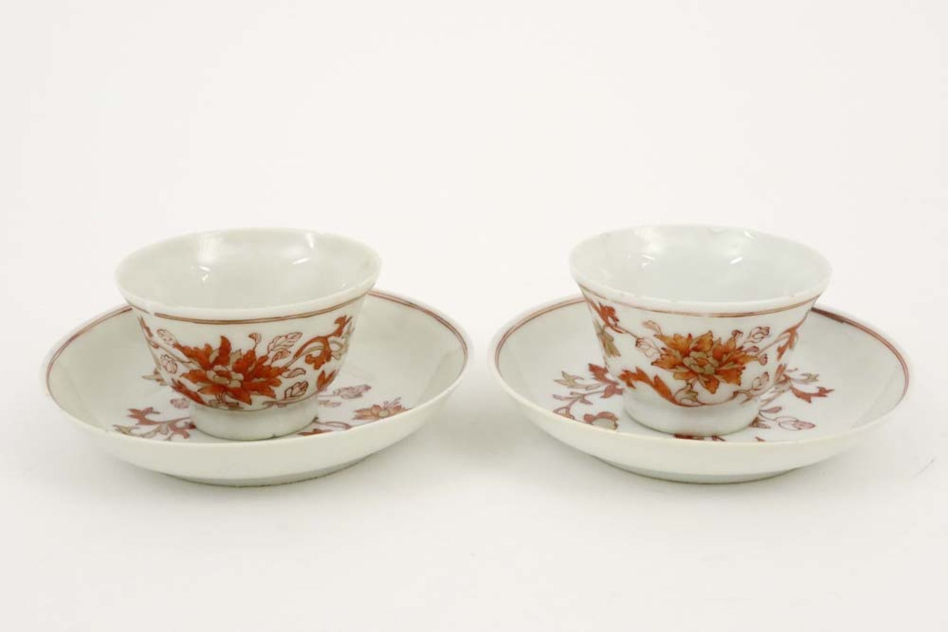 two 18th Cent. Chinese sets of cup and saucer in porcelain with a flower decor in sanguine colors - Image 3 of 7
