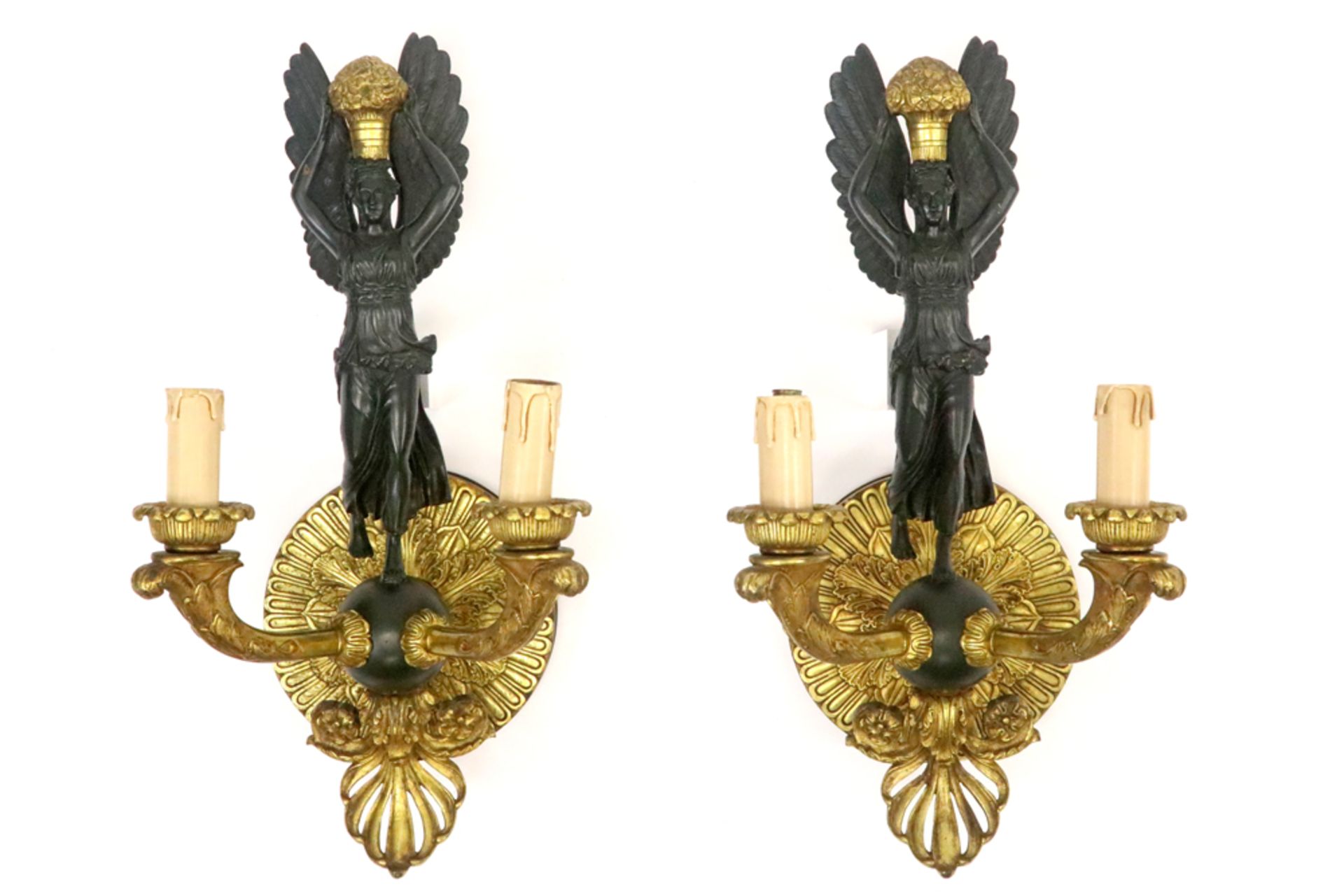 pair of 'antique' Empire style wall lights, each with a female caryatid, in partially gilded