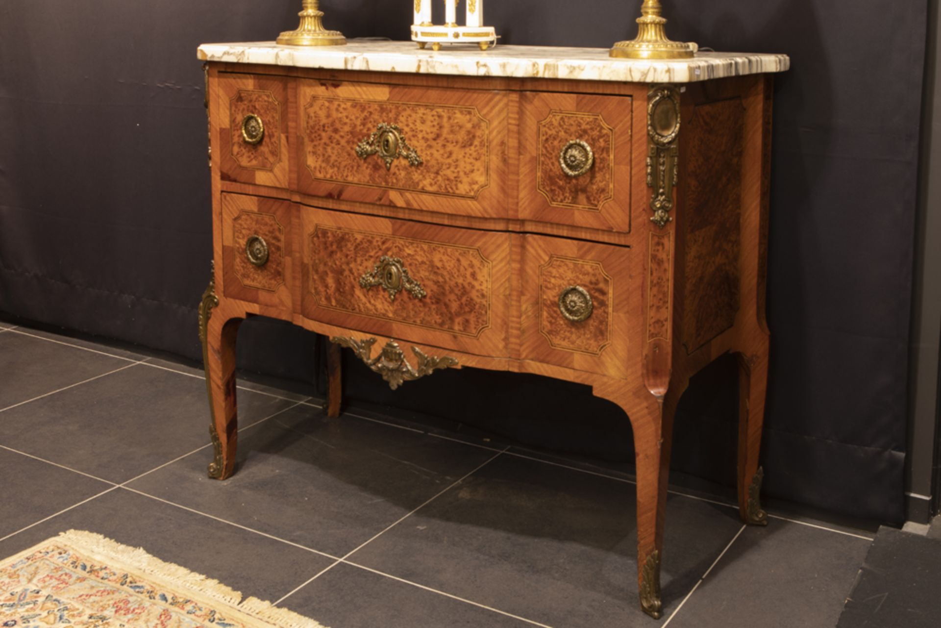 'antique' (bureau) chest of drawers in marquetry with mountings in gilde bronze and with a marble