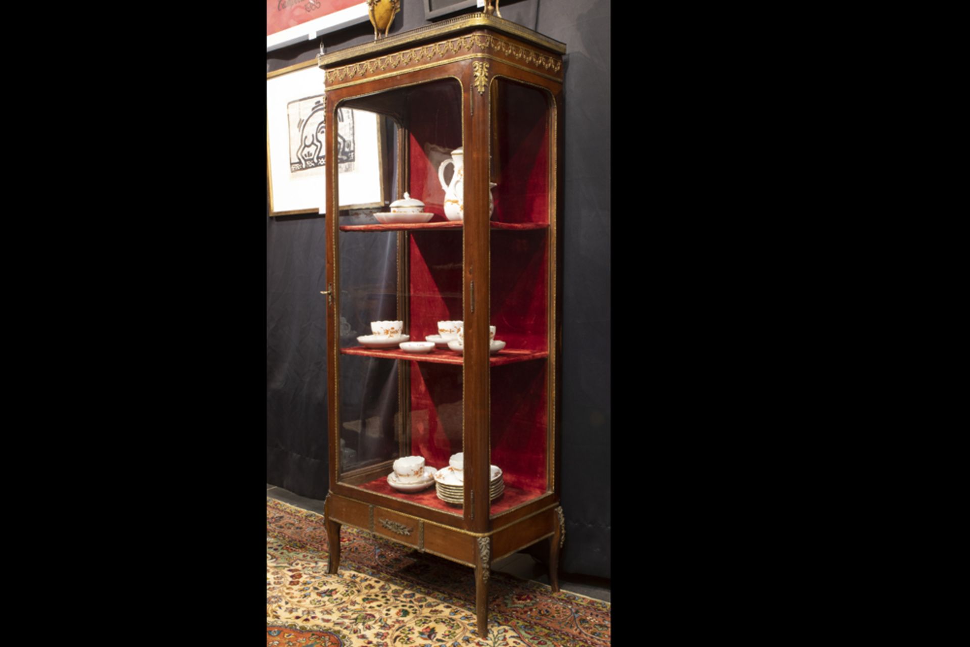 small 'antique' probably French display cabinet in mahogany with mountings in gilded bronze and with