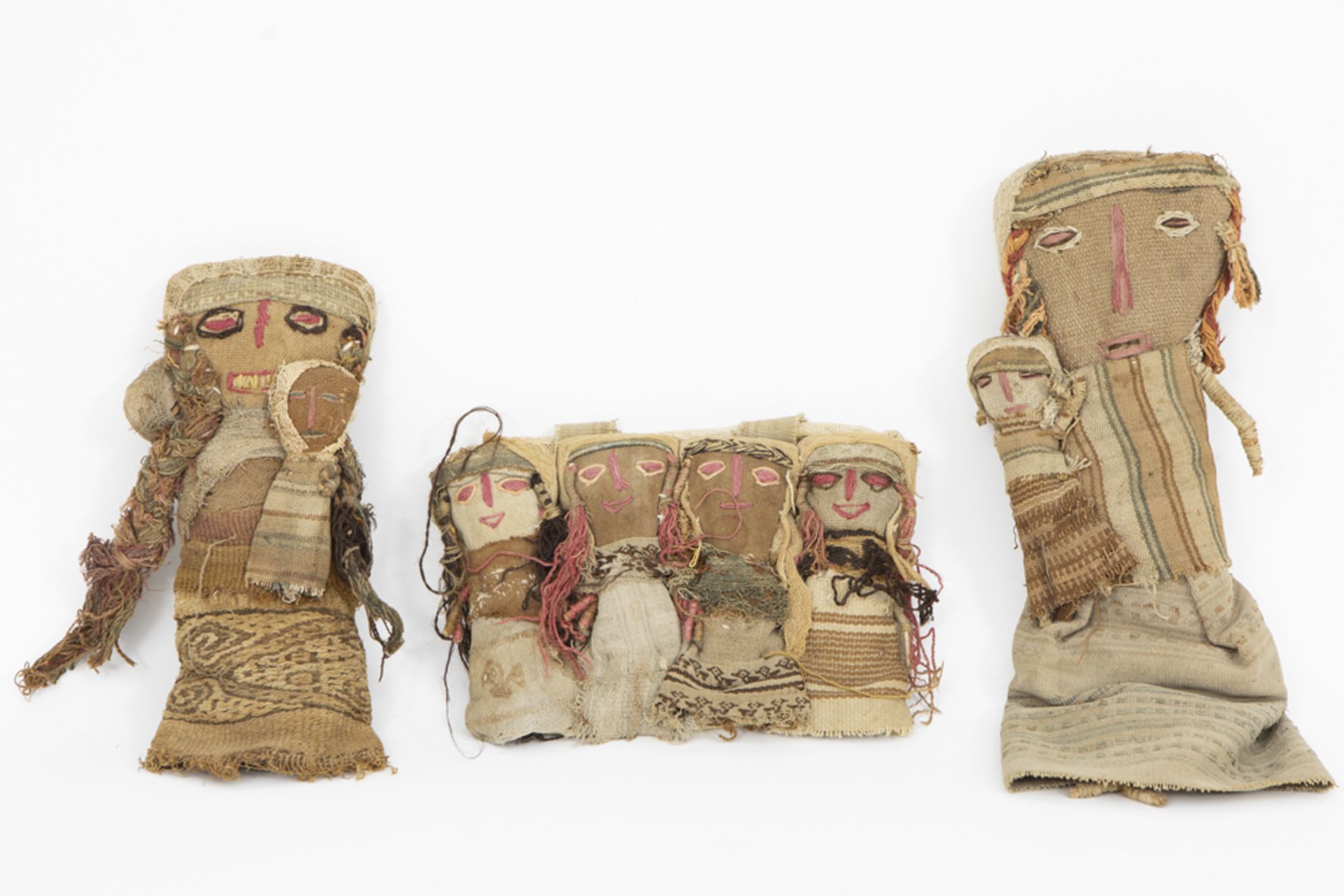two Chancay area funerary dolls and a bag with dolls from the central coast valleys of Peru ||